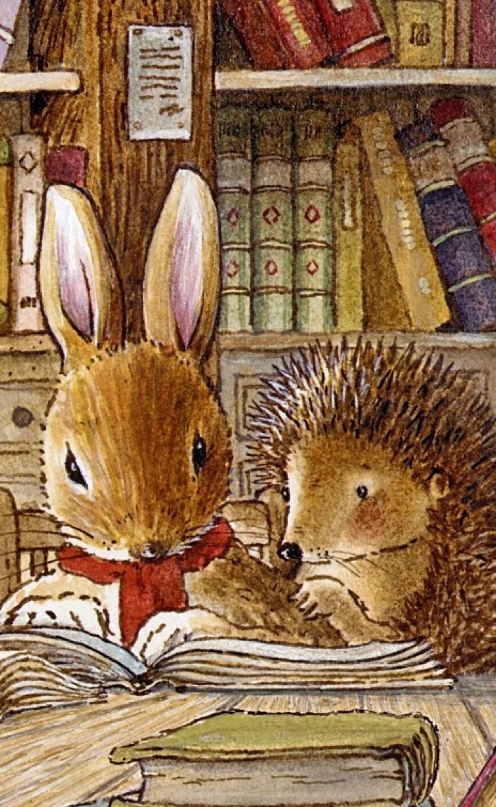 Willy Hedgehog leaning over an open book beside his friends